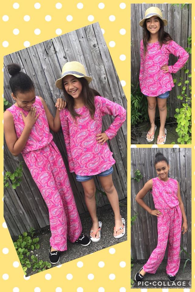 Two girls wearing matching pink pieces of clothing