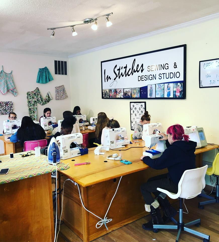 Girls sewing at our studio
