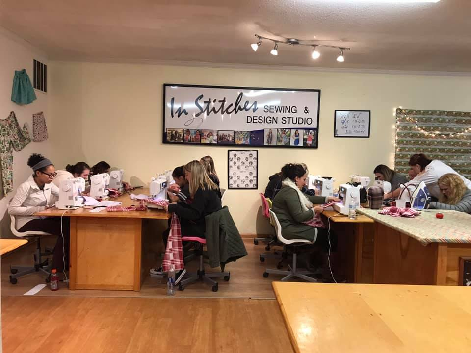 Teens and girls sewing at our studio